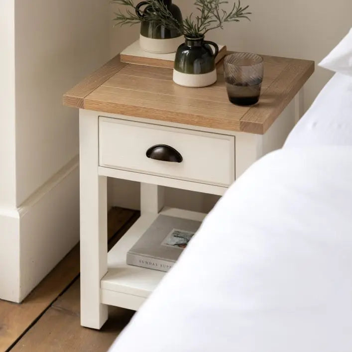 Gallery Direct Eton Bedside Table in White painted wood features 1 drawer with metal handle and a lower shelf. 