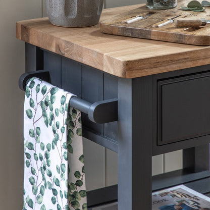 Gallery Direct Eton Butchers Block in Meteor, a deep grey/blue colour with a natural solid oak wood top, 2 shelves, 1 drawer and a side hanging rail