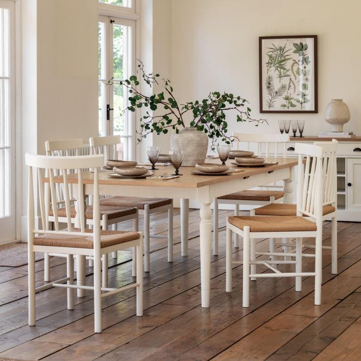 Gallery Direct Eton Extending Rectangular Dining Table with a white painted wood frame and a natural finished extending table top that can seat up to 8 people