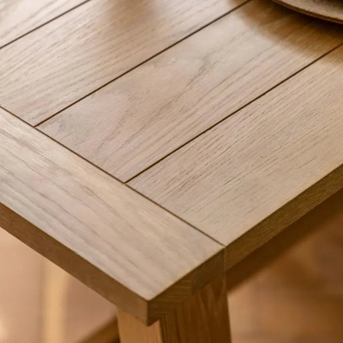 Gallery Direct Eton Extending Trestle Dining Table in Natural features a grooved and planked table top