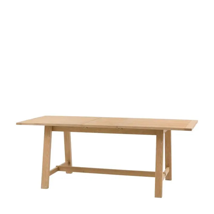 Gallery Direct Eton Extending Trestle Dining Table in Natural with a grooved and planked table top that can seat up to 6 people