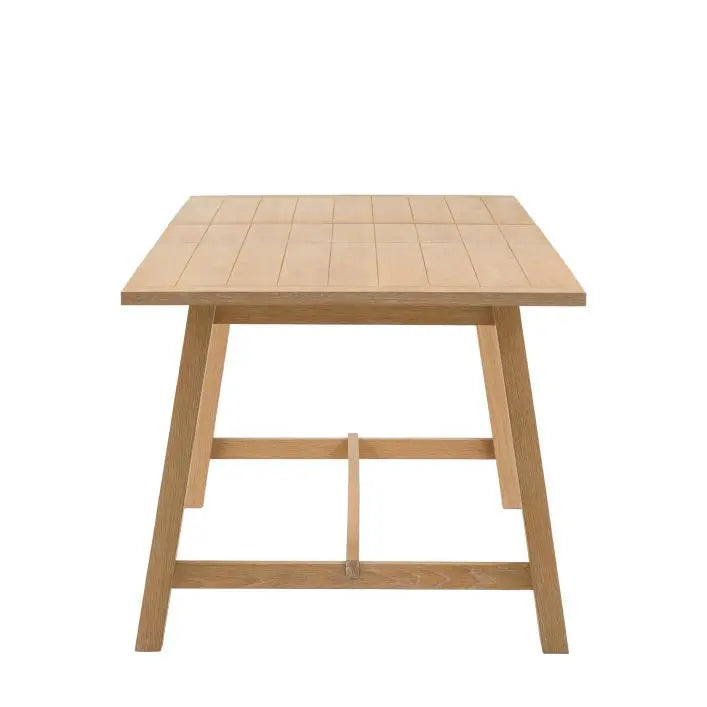 Gallery Direct Eton Extending Dining Table with a grooved and planked table top and trestle style legs in Natural