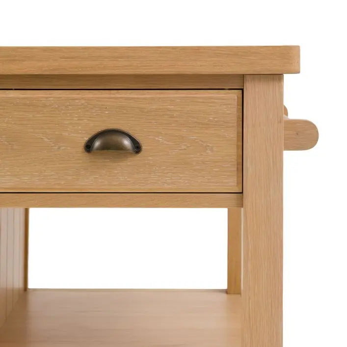 Gallery Direct Eton Kitchen Island in a Natural oak wood finish with 3 drawers and 2 side hanging rails, and plenty of lower shelving space