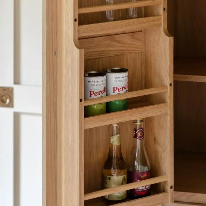 Gallery Direct Eton Larder Cupboard offers plenty of storage space with an upper cupboard with in door shelving space, 3 large shelves, 2 drawers and a planked lower shelf
