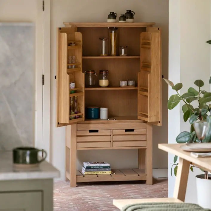 Gallery Direct Eton Larder Cupboard offers substantial storage with 3 large inner shelves, pantry door racks, 2 generous drawers and a planked lower shelf, in a Natural oak wood finish