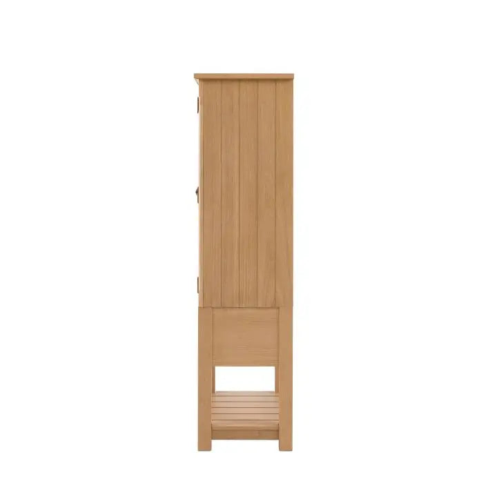 Gallery Direct Eton Larder Cupboard in Natural with grooved panels to the doors and sides, and a lower planked wood shelf