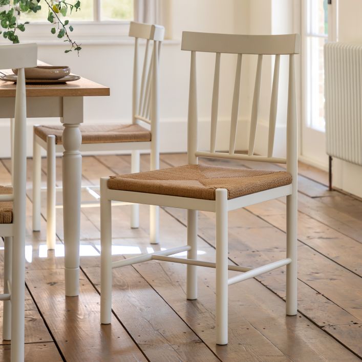 Gallery Direct Eton Pair of Dining Chairs in White painted wood with a natural rope woven seat and spindle backrest 