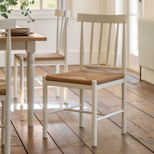 Gallery Direct Eton Pair of Dining Chairs in White painted wood with a natural rope woven seat and spindle backrest 