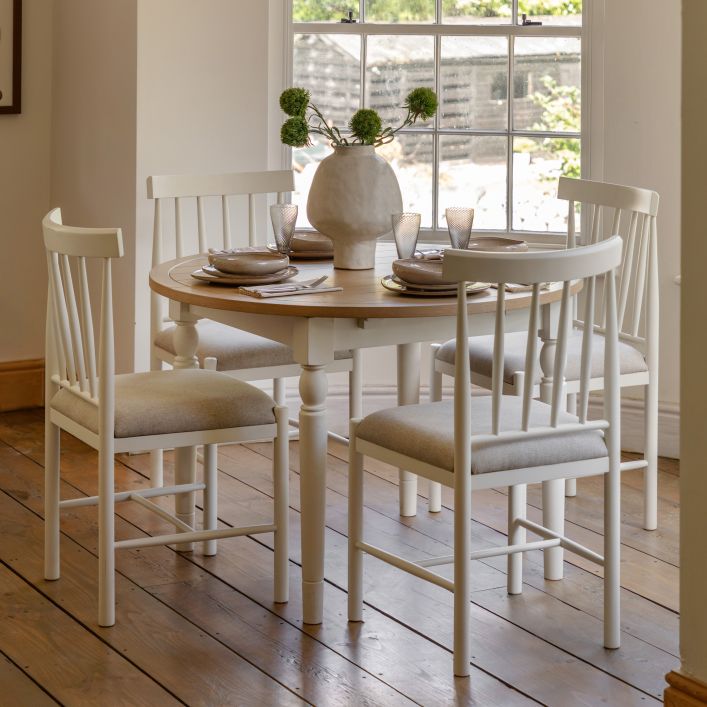 Gallery Direct Eton Round Extending Dining Table in White painted wood with an oak finish table top that can seat 4-6 people when extended
