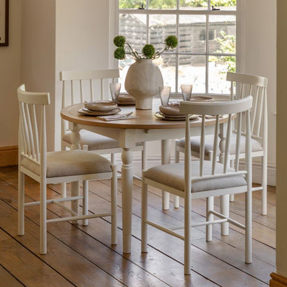 Gallery Direct Eton Round Extending Dining Table in White painted wood with an oak finish table top that can seat 4-6 people when extended