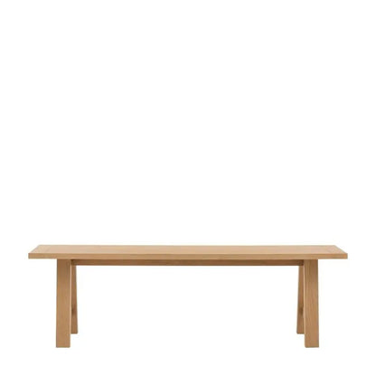 Gallery Direct Eton Trestle Bench features a grooved and planked oak wood seat and a trestle style frame
