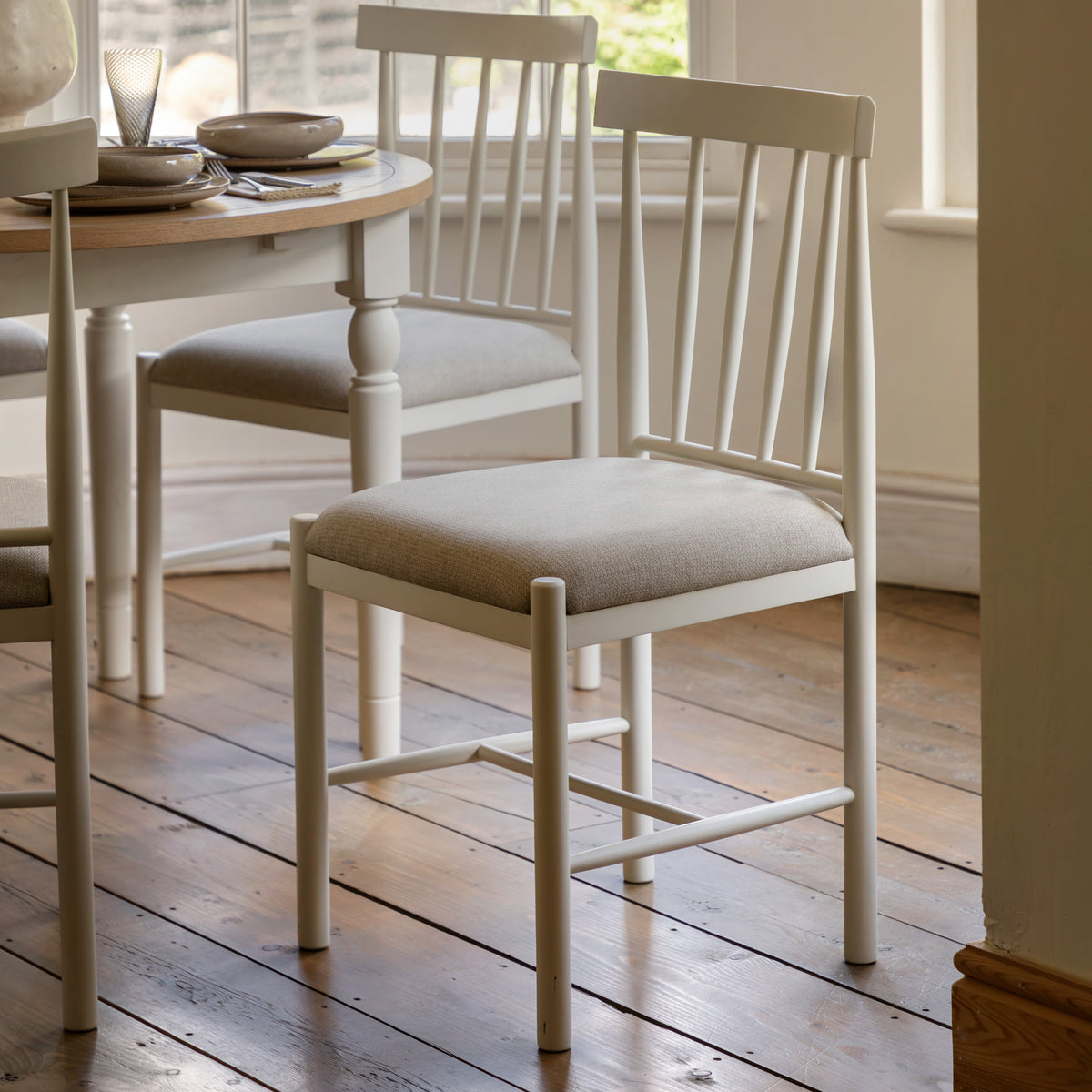 Gallery Direct Eton Upholstered Dining Chairs White styled beside a dining table
