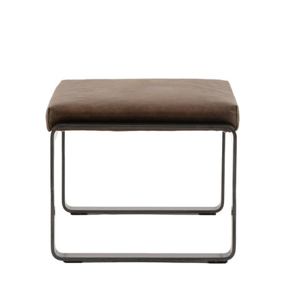 Gallery Direct Fabien Footstool with a Brown Leather upholstered cushioned top and dark metal legs