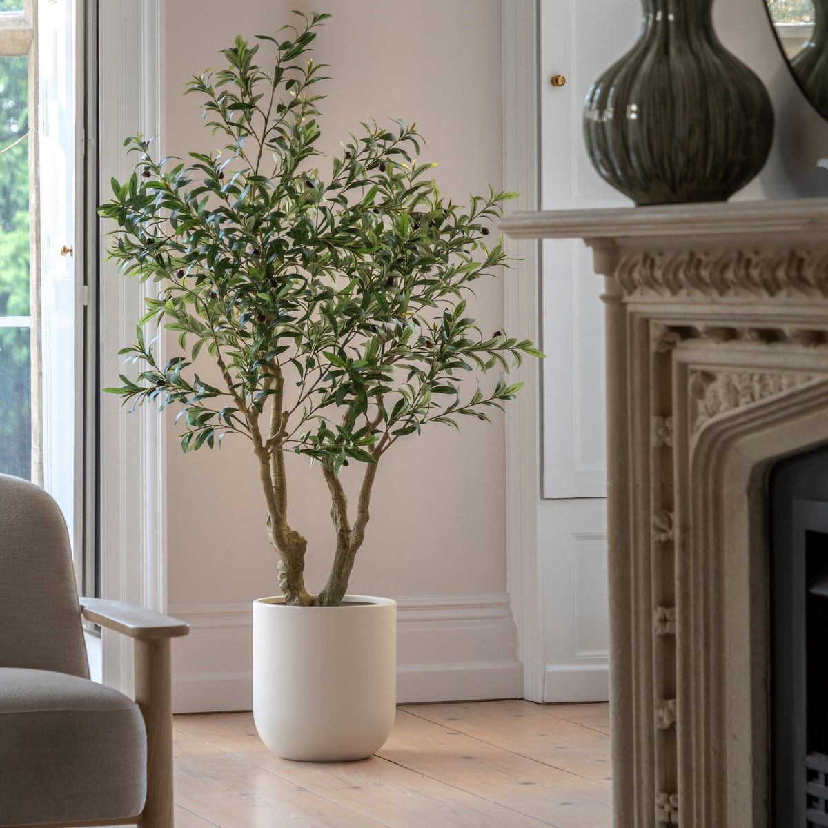 Gallery Direct Faux Olive Tree in White Pot Green, styled in a supplier lifestyle setting