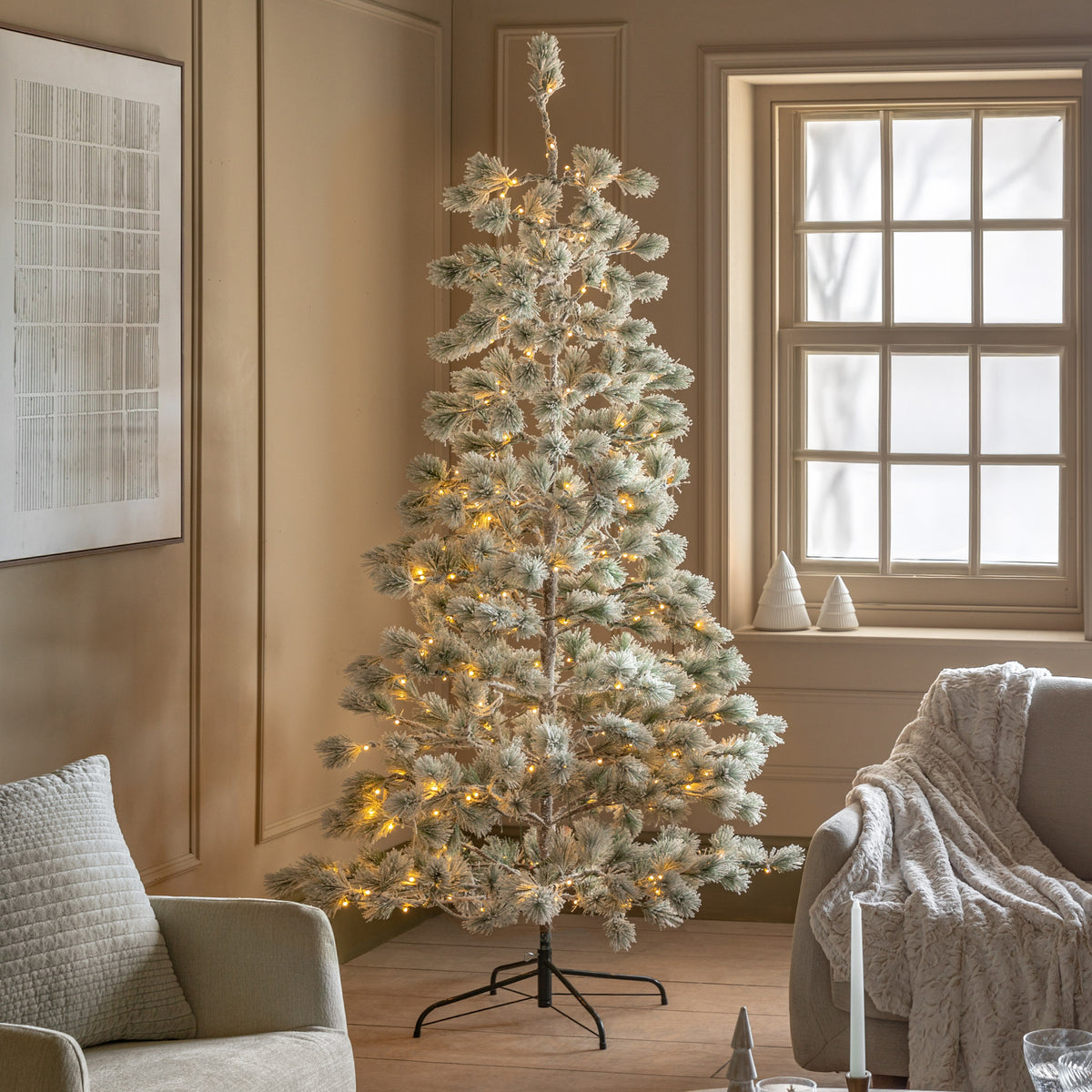 Gallery Direct Flocked Pine LED M Christmas Tree Green and White Large, styled in a supplier lifestyle setting