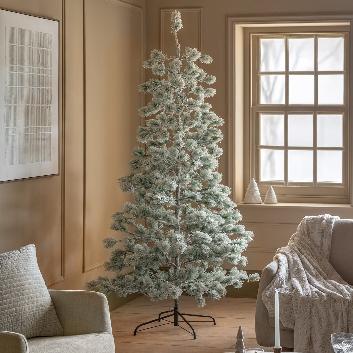 Gallery Direct Flocked Pine LED M Christmas Tree Green and White Large, styled in a supplier lifestyle setting