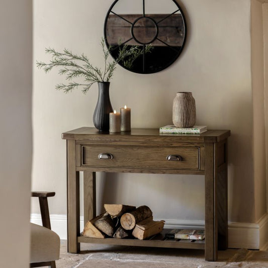Gallery Direct Hardwick Console Table is constructed from solid oak and veneers and features 1 Top Drawer with two metal handles, plus a lower shelf for additional storage or display purposes