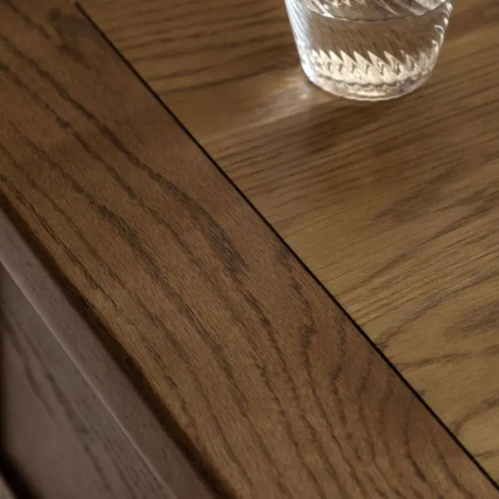 Gallery Direct Hardwick 2 Drawer Coffee Table has a rectangular table top constructed from oak wood and veneers for a natural warm wood finish