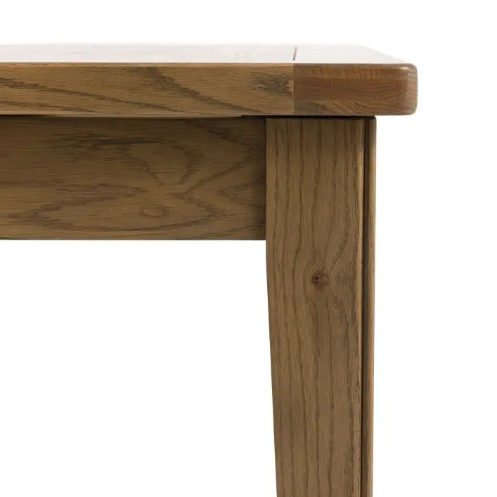 Gallery Direct Hardwick Extending Dining Table is crafted using oak solids and veneers in a warm natural wood finish