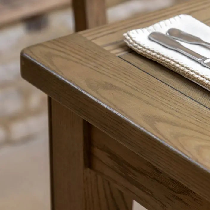 Gallery Direct Hardwick Extending Dining Table crafted from oak wood solids and veneers with a natural warm wood finish and gently rounded corners