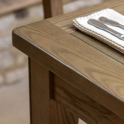 Gallery Direct Hardwick Extending Dining Table crafted from oak wood solids and veneers with a natural warm wood finish and gently rounded corners