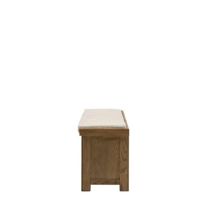 Gallery Direct Hardwick Hall Bench features a natural coloured cushioned seat and a warm oak wood and veneer frame