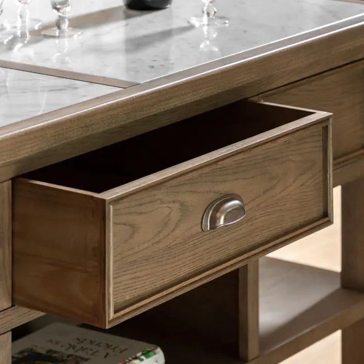 Gallery Direct Hardwick Kitchen Island crafted from solid oak and quality veneers, with metal pull handles to the 3 drawers, and a stunning marble worktop