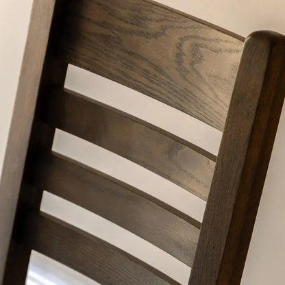 Gallery Direct Hardwick Pair of Dining Chairs features a distinctive slatted back design in a warm natural oak wood   and veneer frame