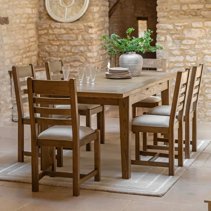 Gallery Direct Hardwick Pair of Dining Chairs crafted from solid oak wood and veneers with a slatted back design and generously padded seat in a neutral colour