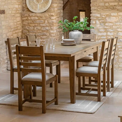 Gallery Direct Hardwick Pair of Dining Chairs crafted from solid oak wood and veneers with a slatted back design and generously padded seat in a neutral colour