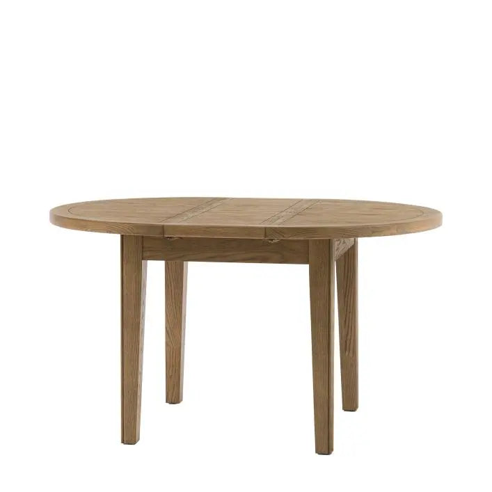 Gallery Direct Hardwick Round 4 seat Dining Table with extending function to create an oval 6 seat table, in a natural warm oak wood finish