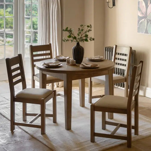Gallery Direct Hardwick Round Extending Dining Table is crafted from natural warm oak wood solids and veneers, with an extending mechanism to allow up to 6 people to sit comfortably