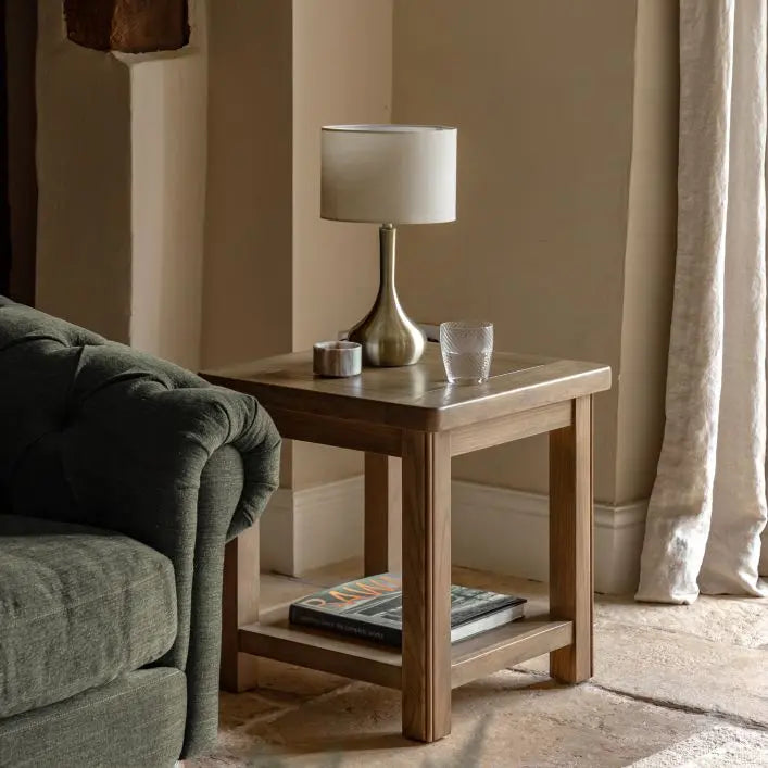 Gallery Direct Hardwick Side Table features a square table top and lower shelf, crafted from solid oak and veneers in a warm natural finish. Works well in both contemporary and traditional interiors