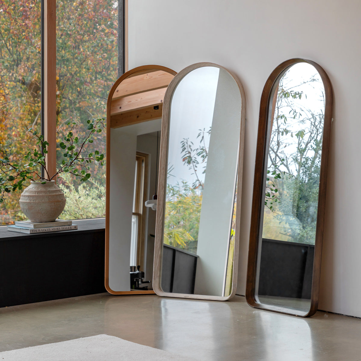Gallery Direct Helsinki Arch Leaner Mirror Walnut displayed in a styled interior