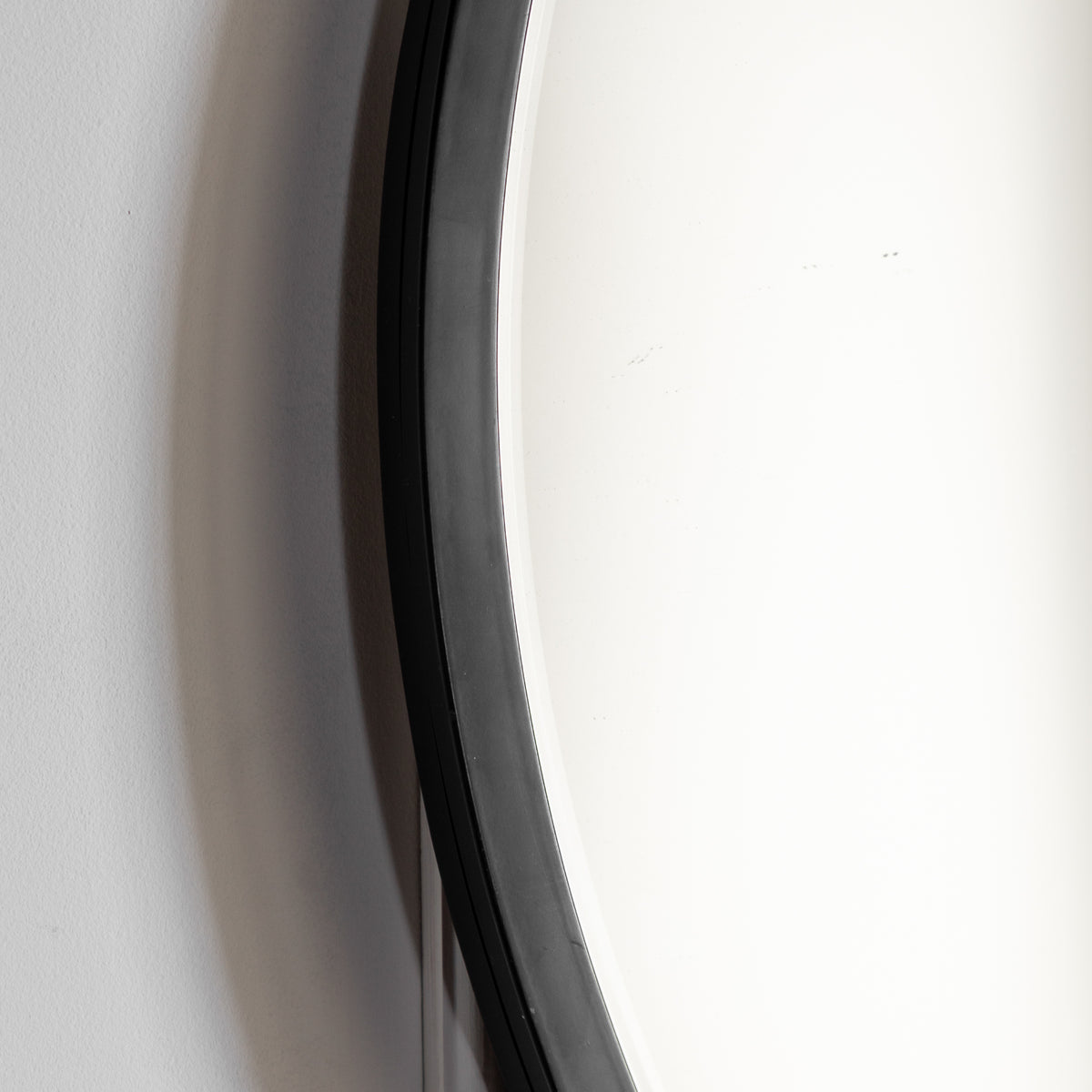 Gallery Direct Higgins Round Mirror Black, close-up of the mirror and frame details