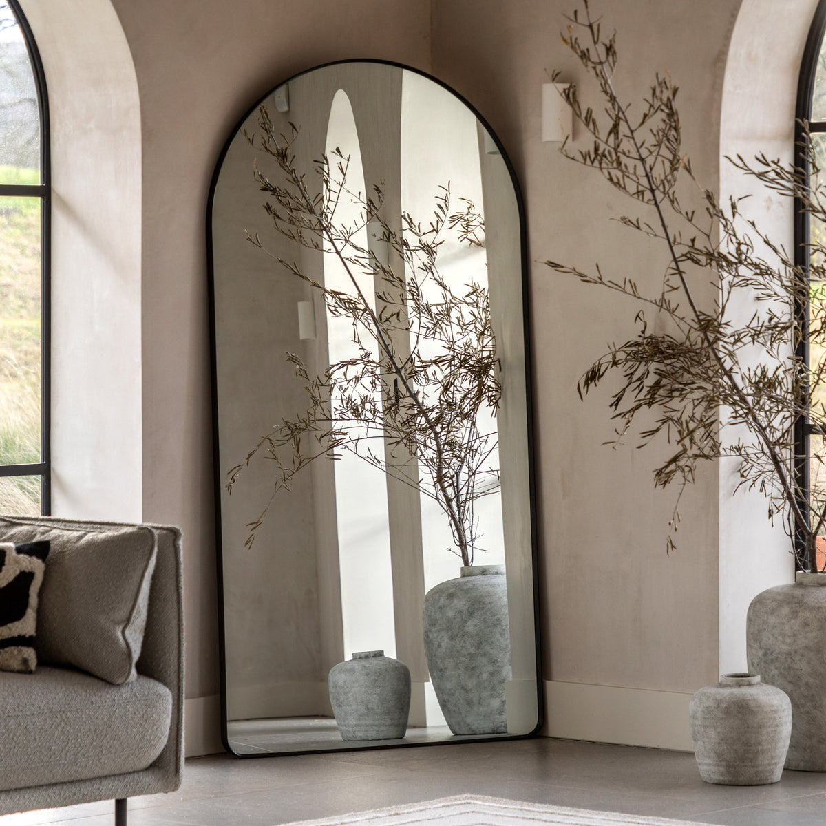 Gallery Direct Holworth Arch Mirror Black displayed in a styled interior