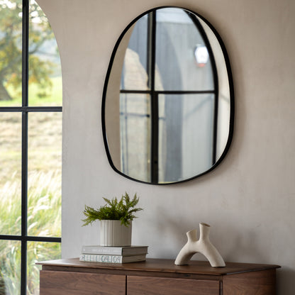 Gallery Direct Holworth Pebble Mirror Black displayed in a styled interior