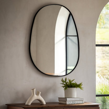 Gallery Direct Holworth Pebble Mirror Black displayed in a styled interior