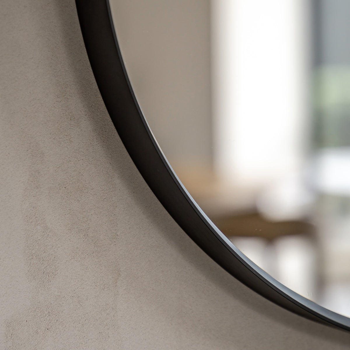 Gallery Direct Holworth Pebble Mirror Black, close-up of the mirror and frame details