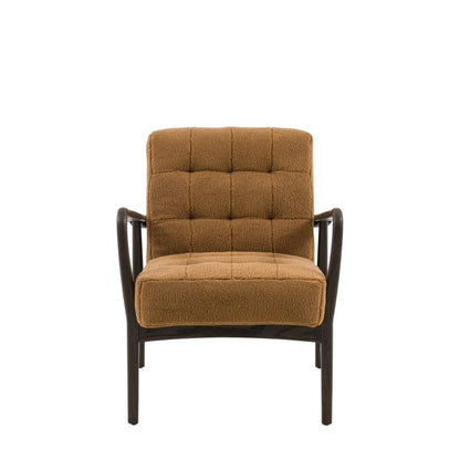 Gallery Direct Humber Armchair is upholstered in a Ochre colour Faux Sheepskin material with a dark ash wood frame