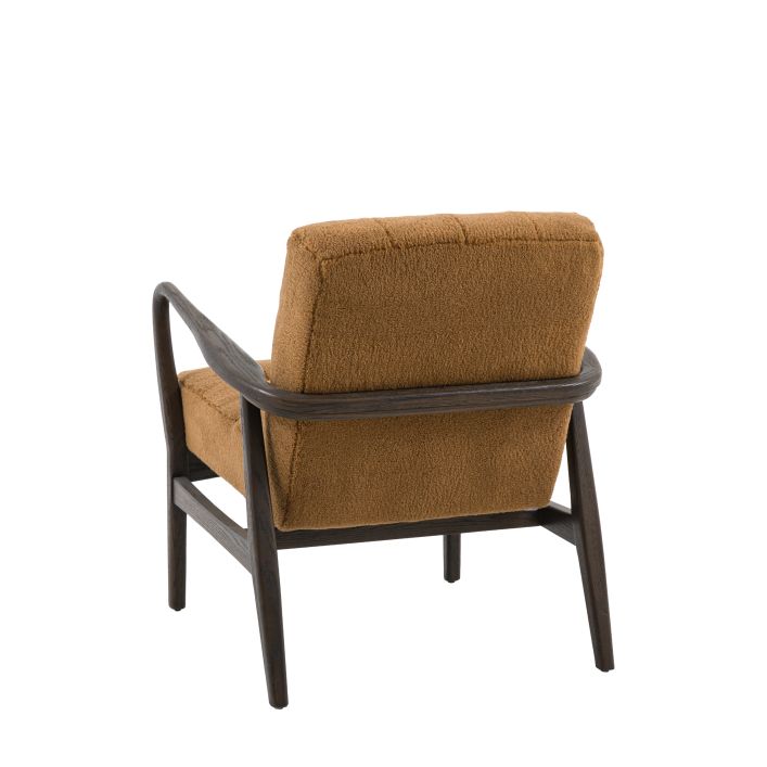 Gallery Direct Humber Armchair upholstered in Ochre Faux Sheepskin material with a dark wooden frame