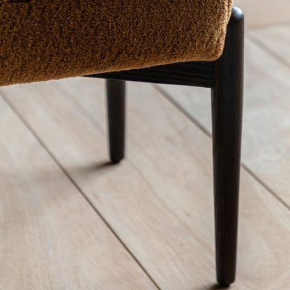 Gallery Direct Humber Footstool in Ochre Faux Sheepskin with solid dark wooden base and legs
