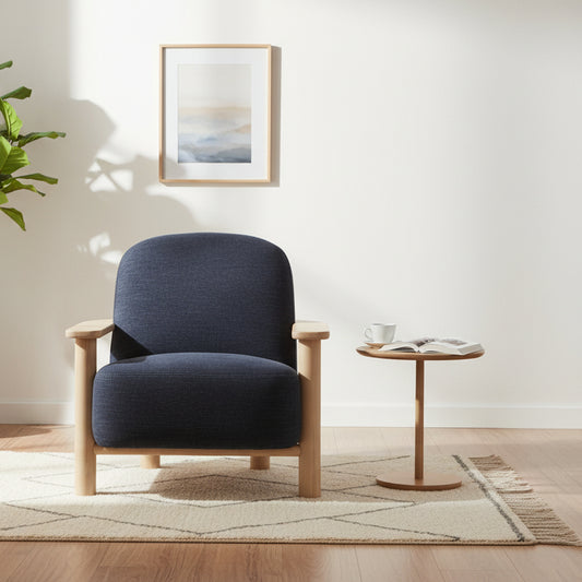 The Gallery Direct Husby Armchair features a generously cushioned seat in Willow Pacific blue coloured fabric that sits within a modern light wood frame