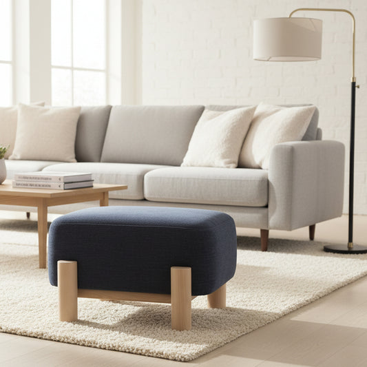 The Gallery Direct Husby Footstool is upholstered in Willow Pacific blue coloured fabric, with a light wood base