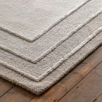 Gallery Direct Ithaca Tonal Border Rug measures 1200x1800mm and features a hand tufted wool and polyester mix for a soft feel underfoot