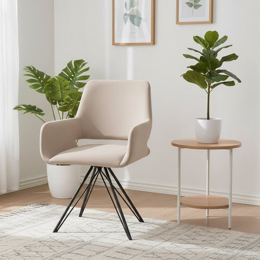 The Gallery Direct Livorno Dining Chair is fully upholstered in a Sand colour fabric and features a high back for added comfort, curved armrests and striking black metal legs