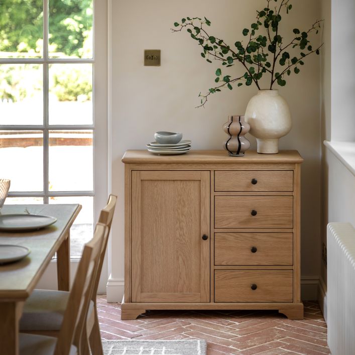 Gallery Direct Malvern 1 Door 4 Drawer Sideboard crafted from oak solids and veneers with wood grains and classic dark handles