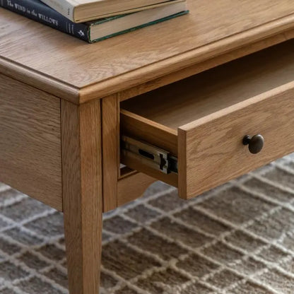 Gallery Direct Malvern Rectangular 1 Drawer Coffee Table constructed from quality oak solids and veneers with natural grain patterns, and dark metal handles