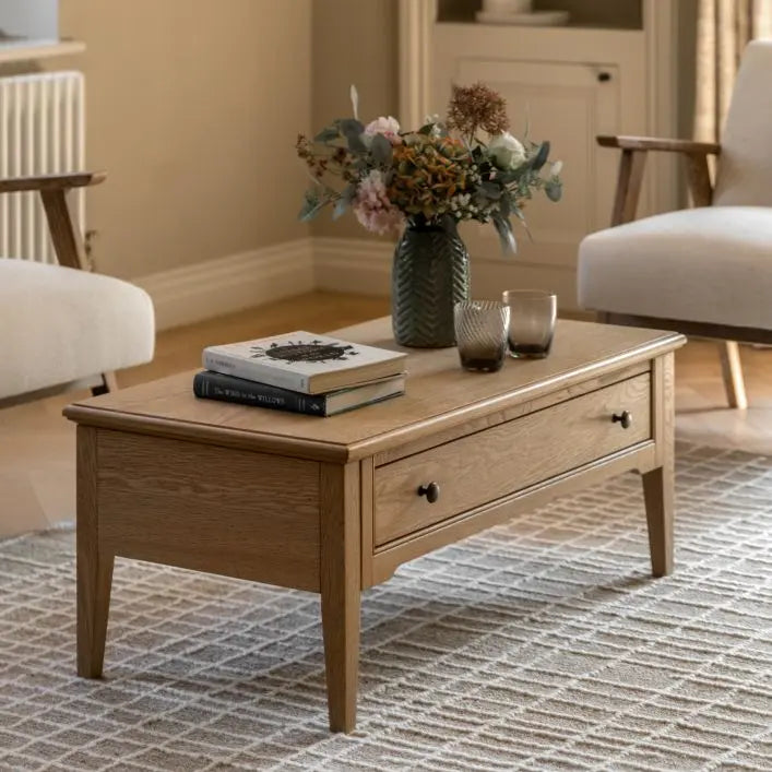 Gallery Direct Malvern Rectangular Coffee Table features 1 wide drawer with metal handles, crafted from quality oak solids and veneers with natural wood-grain patterns and slim tapered legs