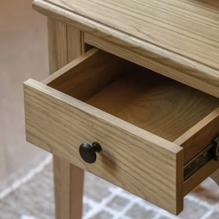 Gallery Direct Malvern Side Table features 1 drawer with a metal handle, crafted from warm oak woods and veneers